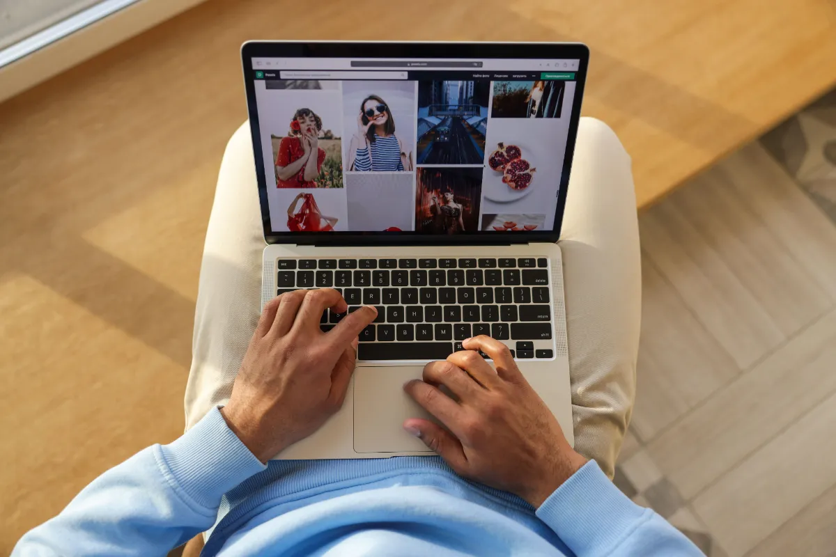 A person browsing the web on a laptop